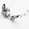 Piciorus presor cu rola dintata de teflon, cu ghidaj spirala si tub pentru atasat siret, elastic sau banda cu latimea de pana la 10mm, pentru masini industriale de cusut simple cu 1 ac